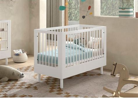 Mosolygós macifejjel díszített babaágy állítható magassággal