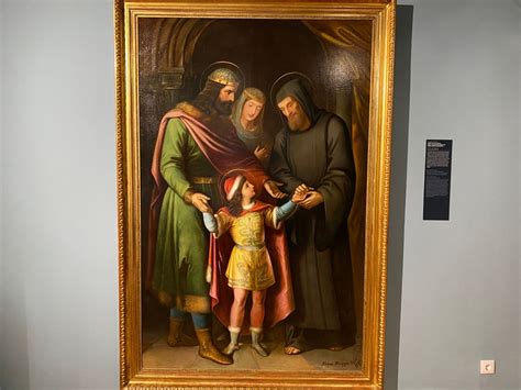 Régi festmény egy bábáról, aki ollót tesz a szülő nő ágya alá